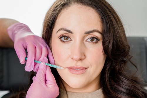 Women getting filler treatment | Get Skin Care treatment in Skin Savvy Aesthetics | Franklin, MA