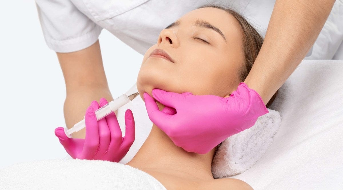 Young lady getting Kybella Treatment | Skin Savvy Aesthetics | Franklin, MA